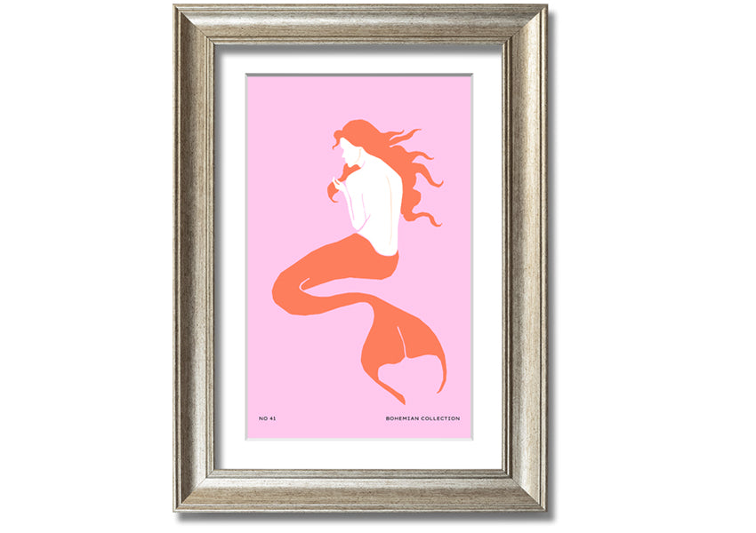 A beautifully illustrated framed print of a mermaid on a soft pink background, showcasing vibrant colors and intricate details.