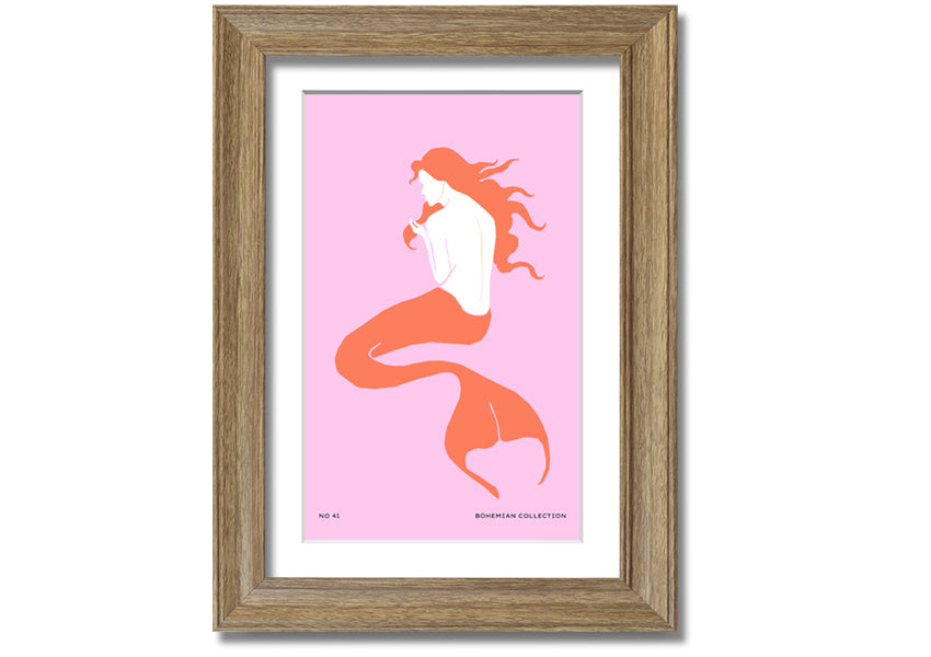 A beautifully illustrated framed print of a mermaid on a soft pink background, showcasing vibrant colors and intricate details.