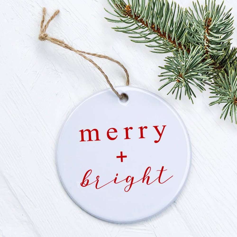 Merry + Bright Script Christmas Ornament made of high-quality porcelain with a glossy finish, featuring original festive designs.