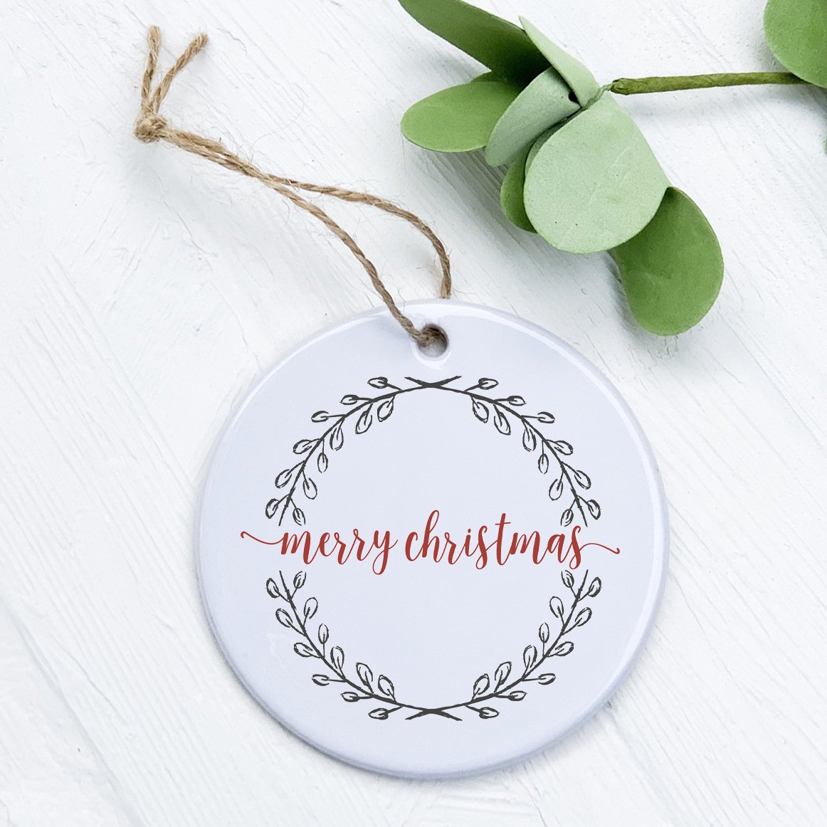 Merry Christmas Wreath ornament made of high-quality porcelain with a vibrant design, perfect for holiday decor or as a gift tag.