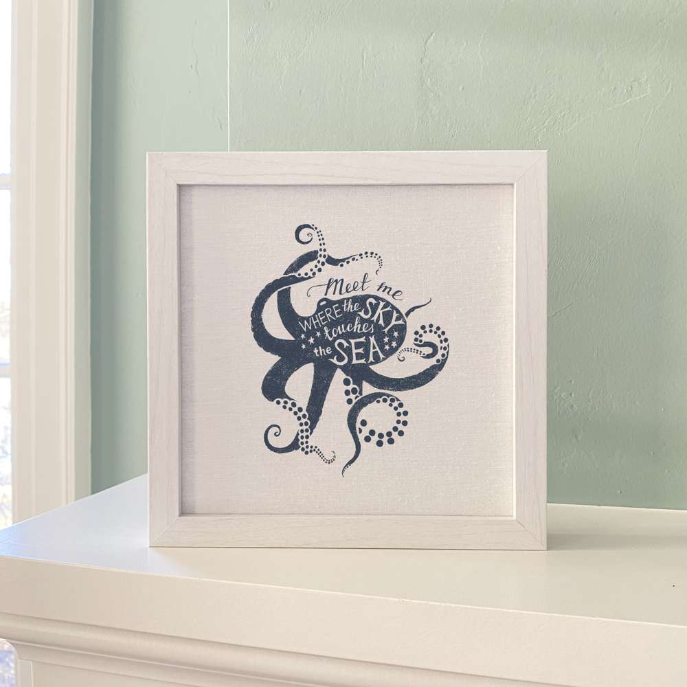 Meet Me (Octopus) framed sign with a stylized octopus design in a walnut or white-washed frame, set against a linen-look neutral background.