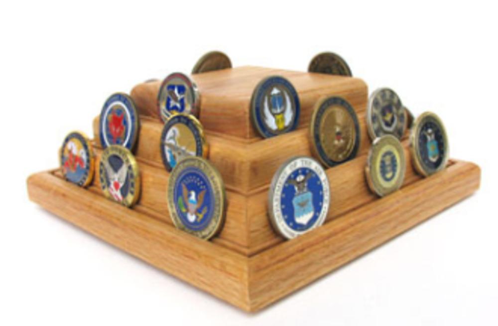 A beautifully crafted Pyramid Coin Display made from solid oak, showcasing military challenge coins in an elegant arrangement.