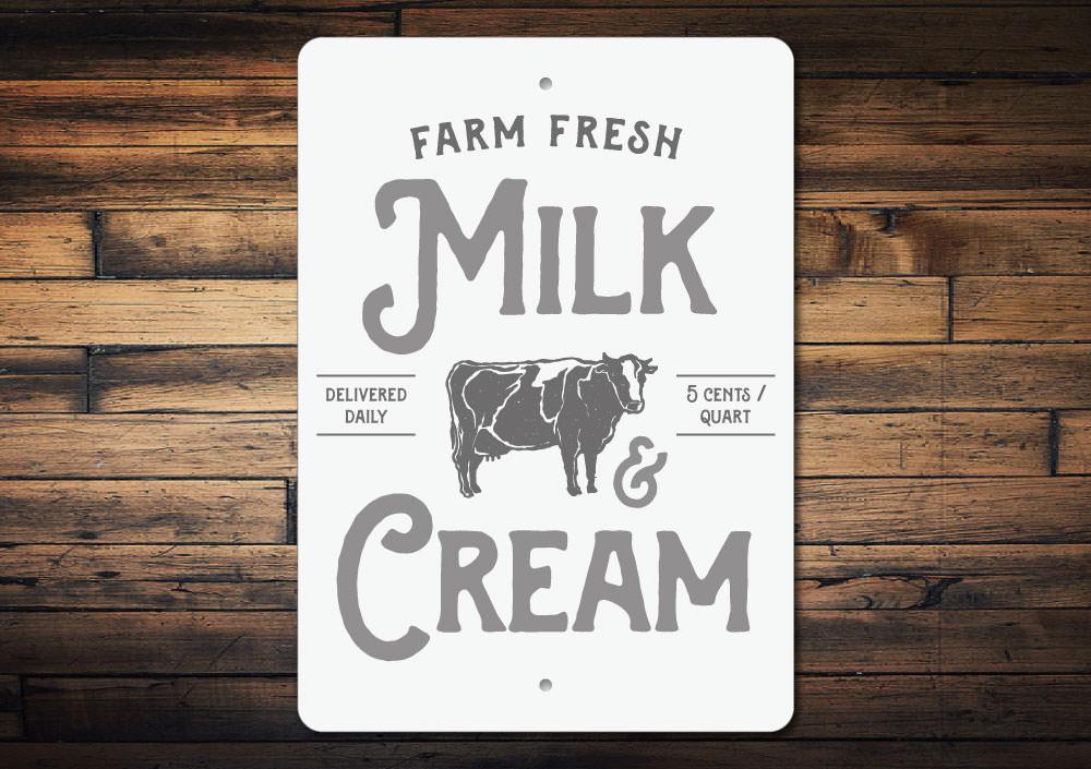 A decorative Milk & Cream Sign made of high-quality aluminum, featuring customizable text options, perfect for kitchen decor.