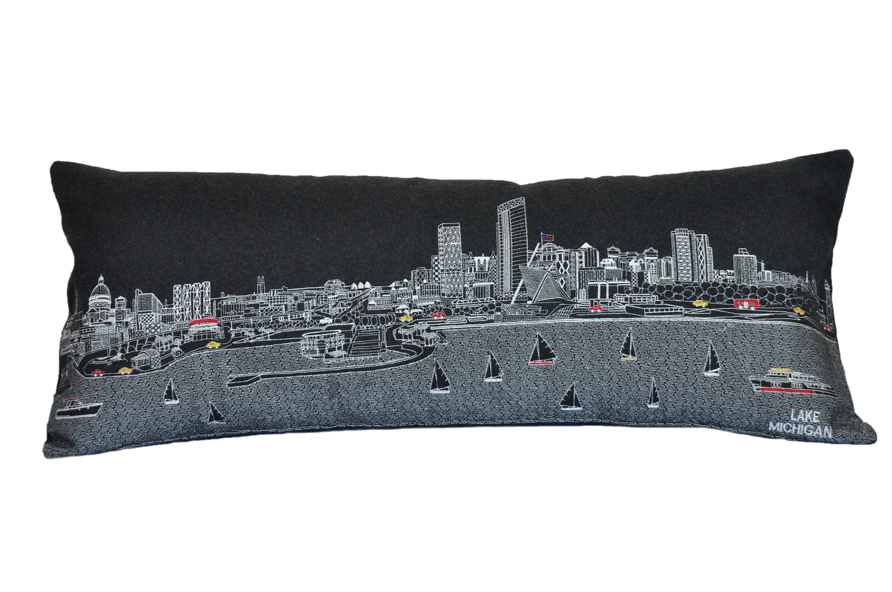 Milwaukee Pillow featuring embroidered graphics of iconic Milwaukee attractions with a red zipper at the bottom.