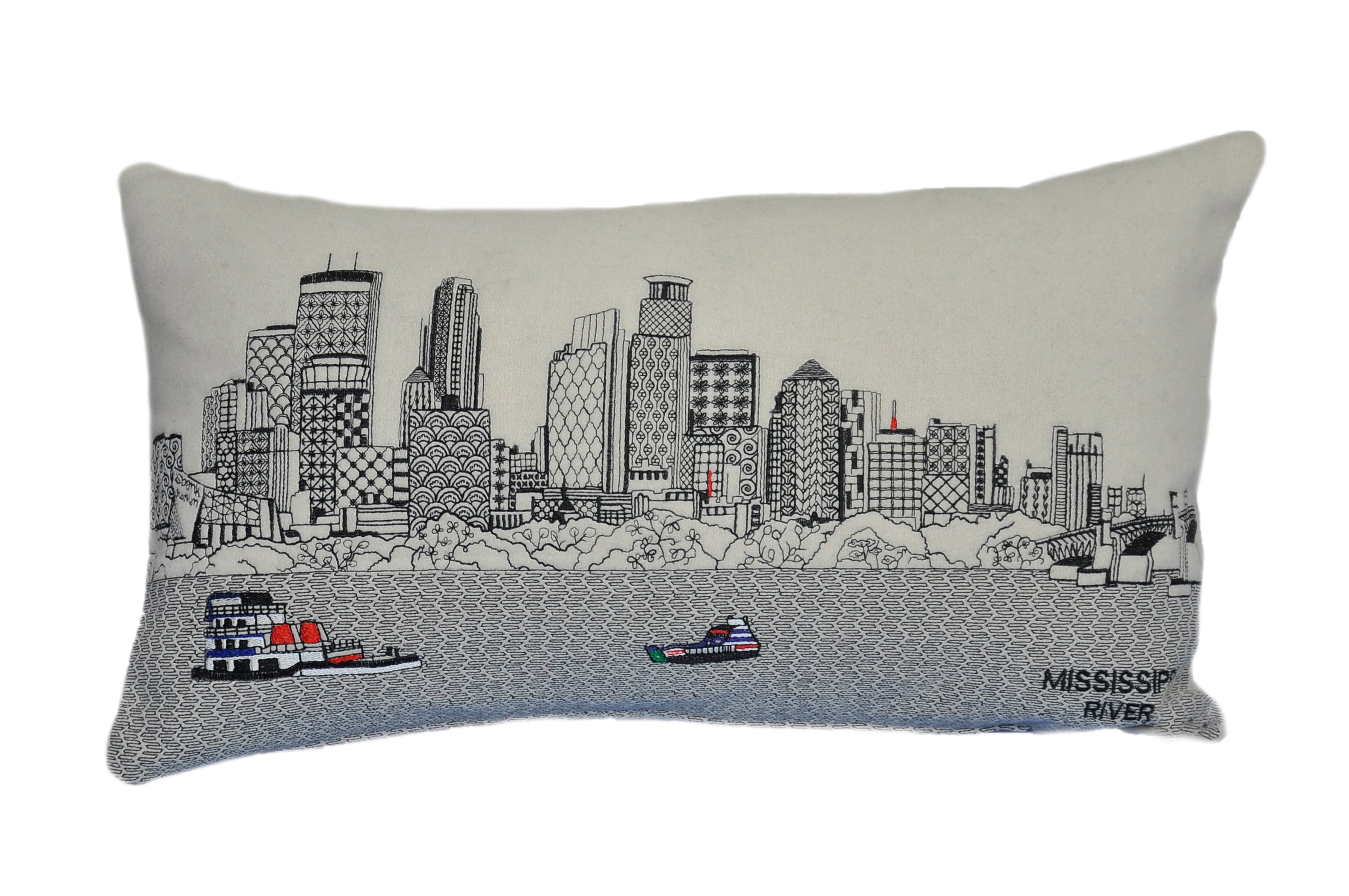 Minneapolis Pillow featuring embroidered landmarks like Foshay Tower and US Bank Stadium, with a red zipper at the bottom.