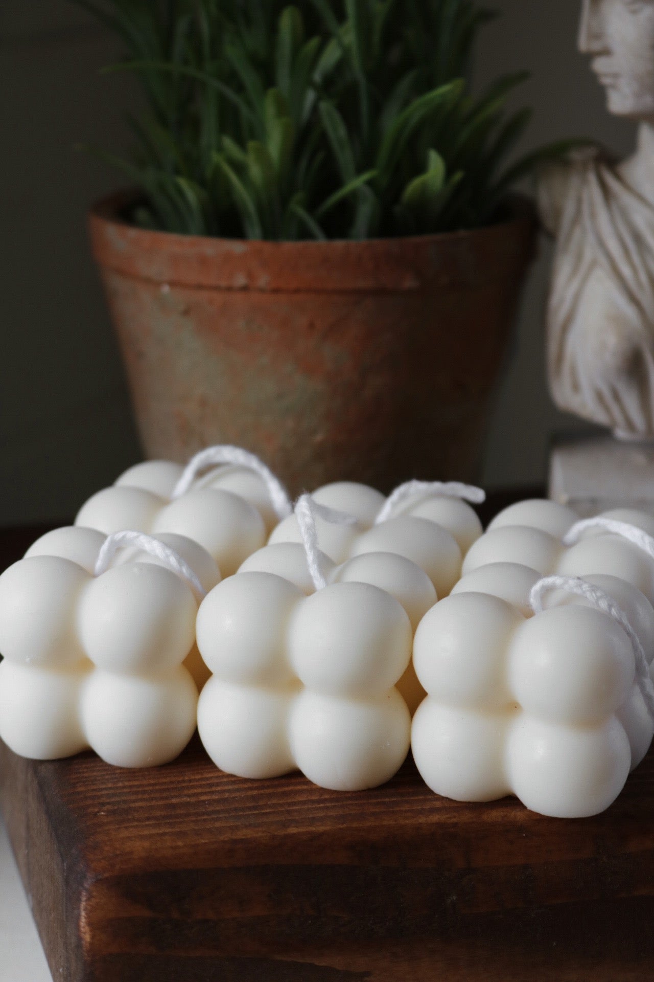 A beautifully crafted Mini Bubble candle in soft cream color, showcasing its sculptural design and hand poured quality.