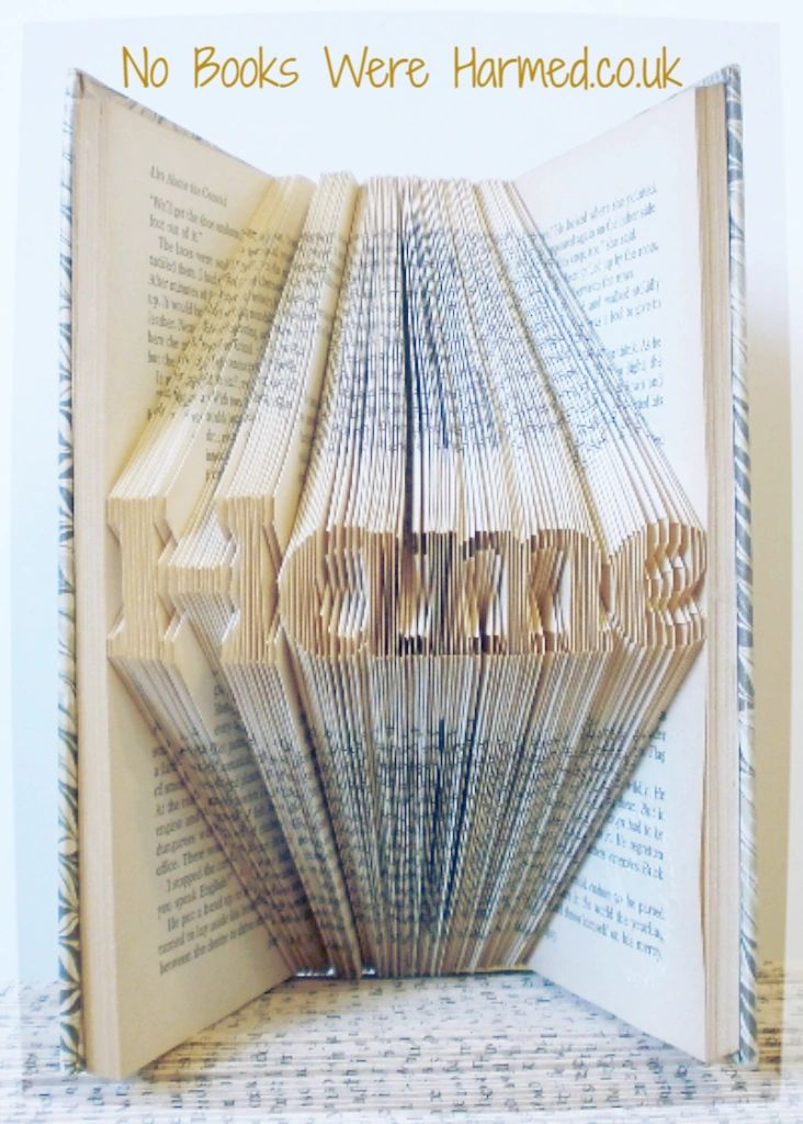 A handcrafted Mini 'Hame' art piece made from vintage book pages, showcasing intricate folds and unique design.