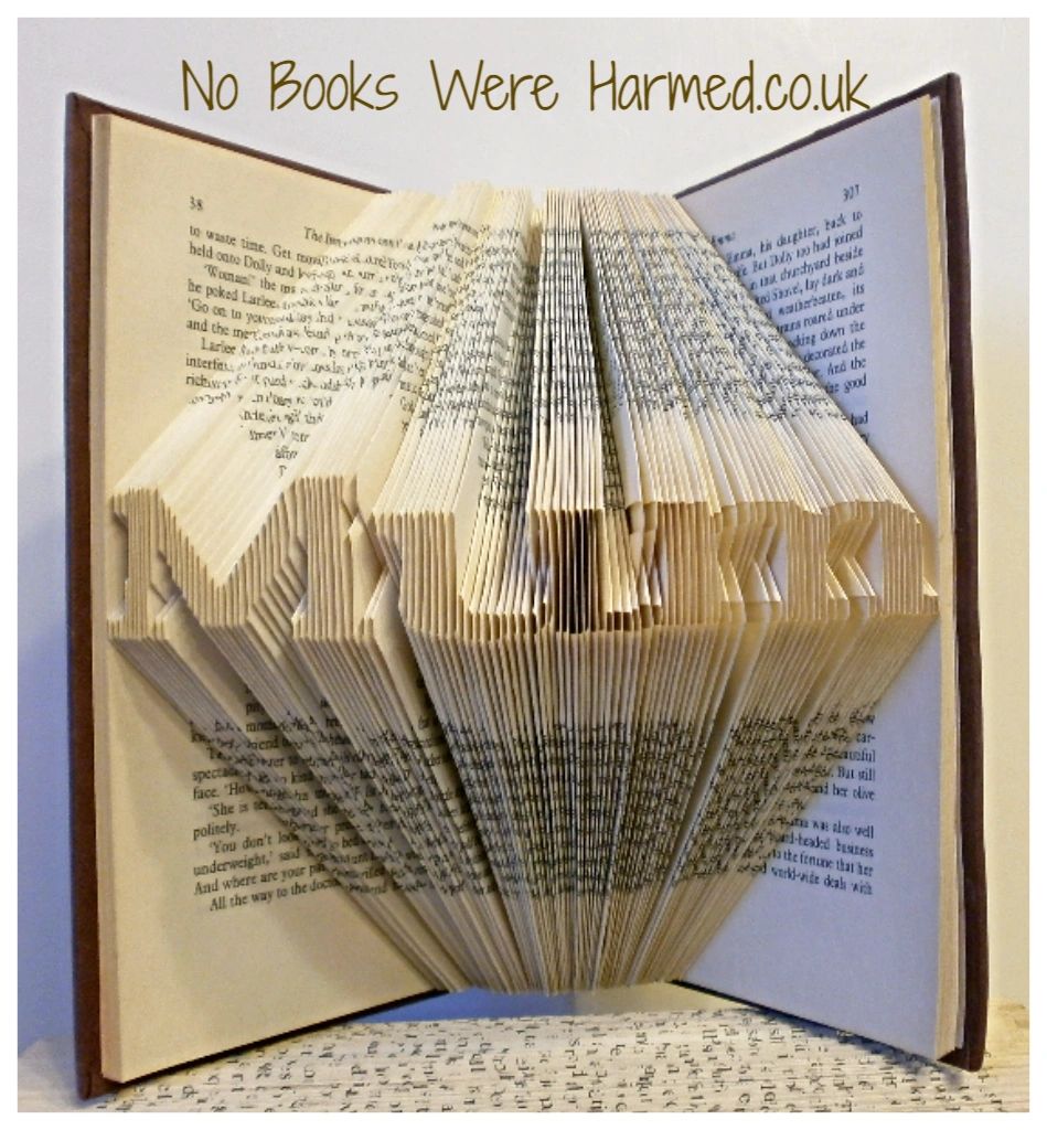 Mini 'Mum' book art piece, hand-folded from vintage book pages, showcasing unique design and craftsmanship.