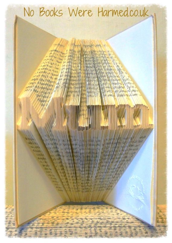 Mini 'Mum' book art piece, hand-folded from vintage book pages, showcasing unique design and craftsmanship.