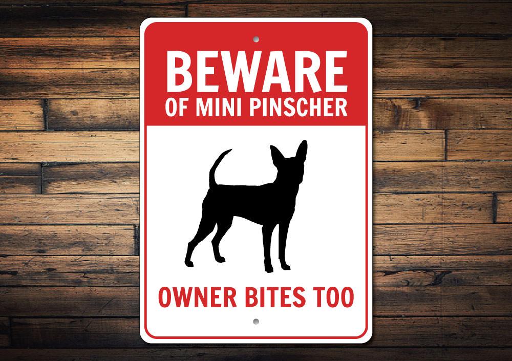 A decorative Mini Pinscher sign made of aluminum, showcasing a charming design perfect for home decor.