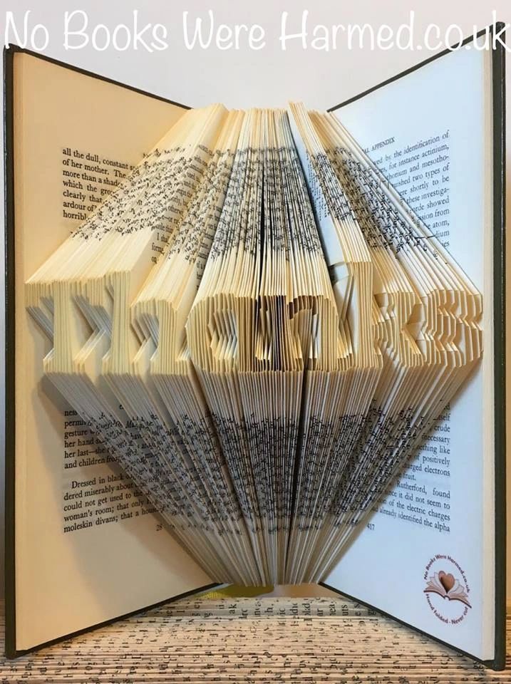 Mini 'Thanks' art piece handcrafted from vintage books, showcasing unique hand-folded pages in an elegant design.