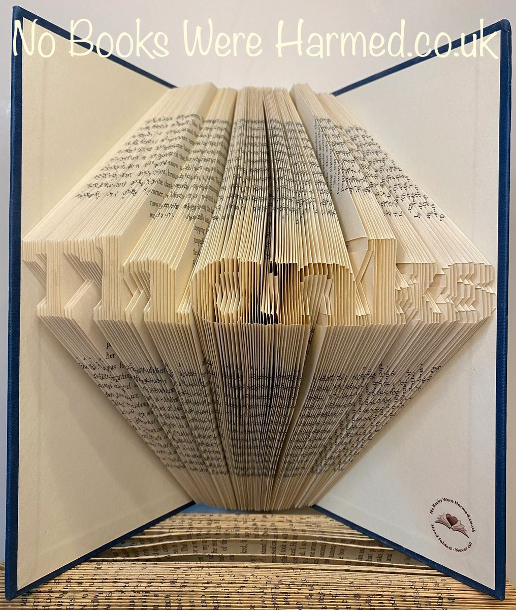 Mini 'Thanks' art piece handcrafted from vintage books, showcasing unique hand-folded pages in an elegant design.