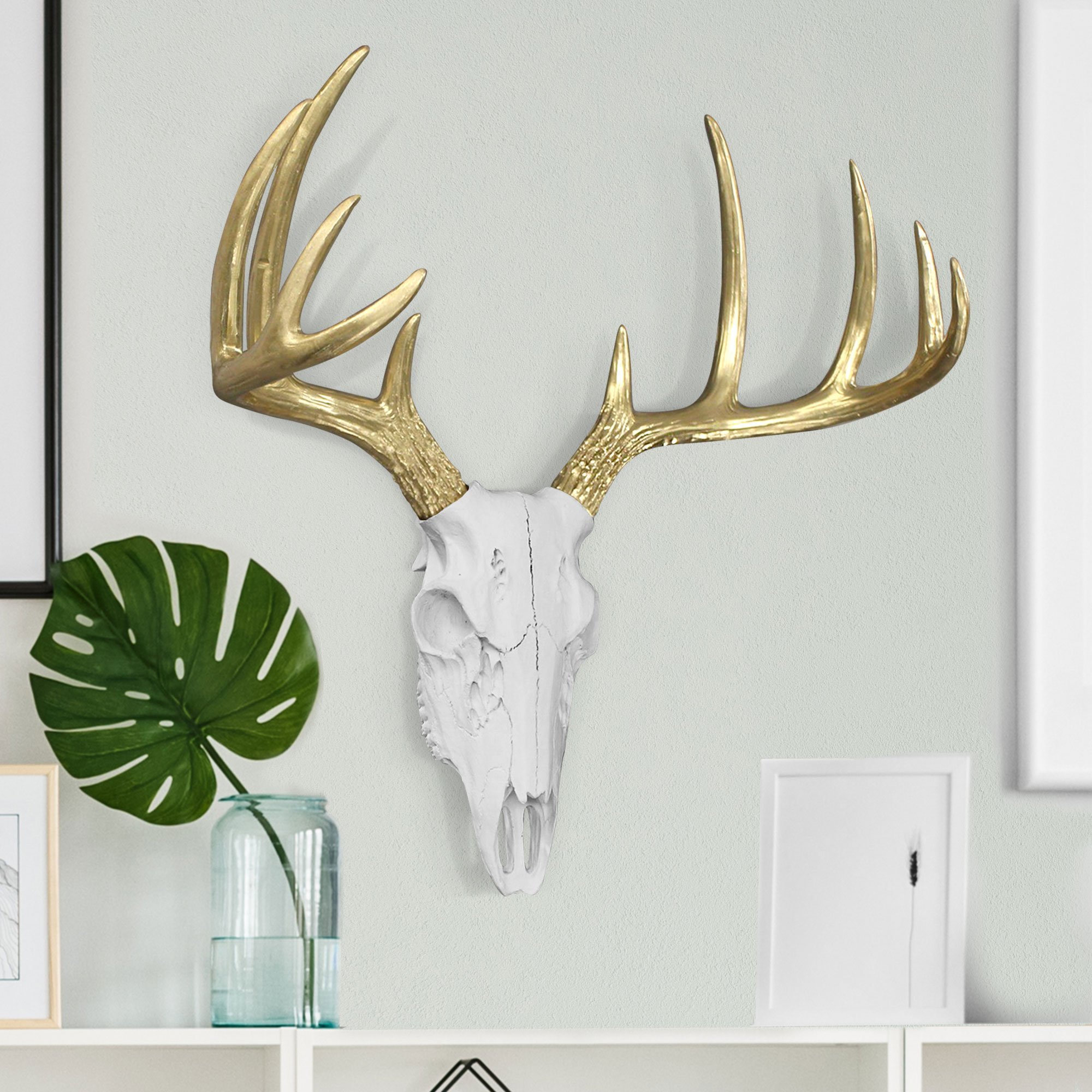 Mini White and Gold Deer Skull decor piece, handcrafted from eco-friendly resin, showcasing intricate details and a stylish design.