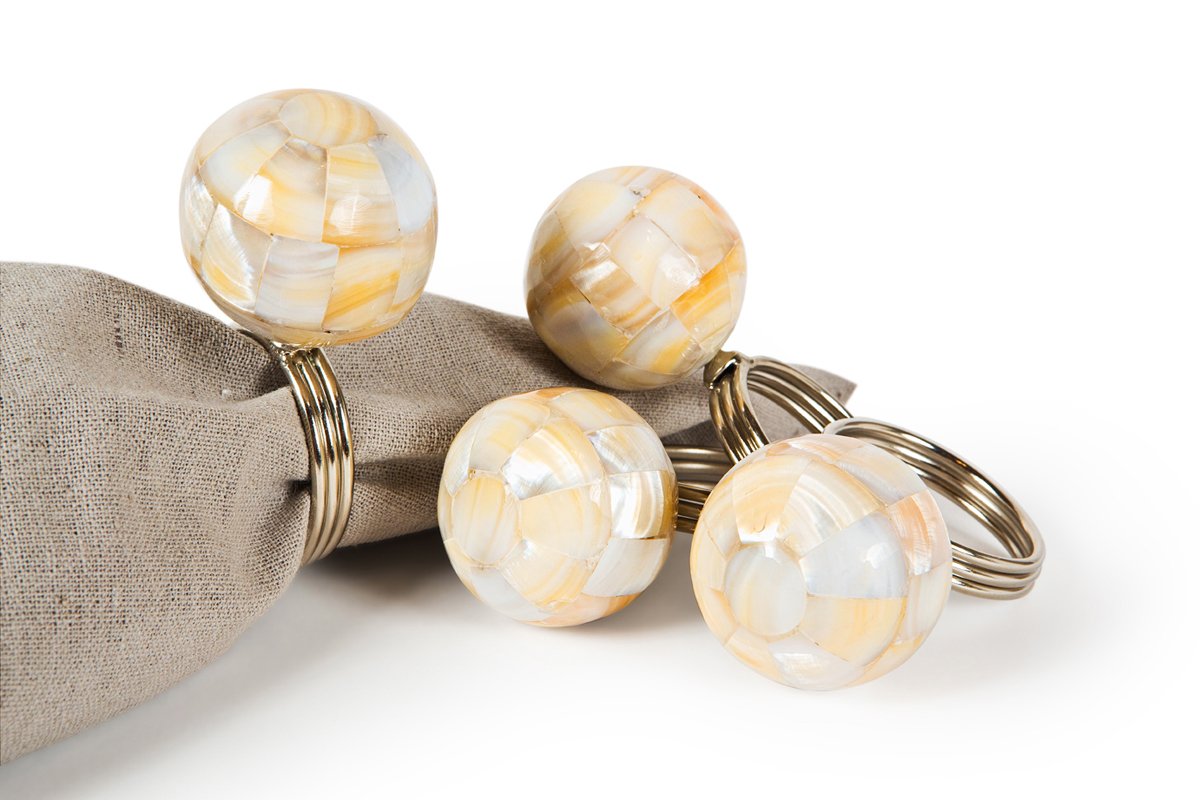 Set of four ML15825 Mother of Pearl Ball Napkin Rings with elegant inlay design, perfect for enhancing table settings.