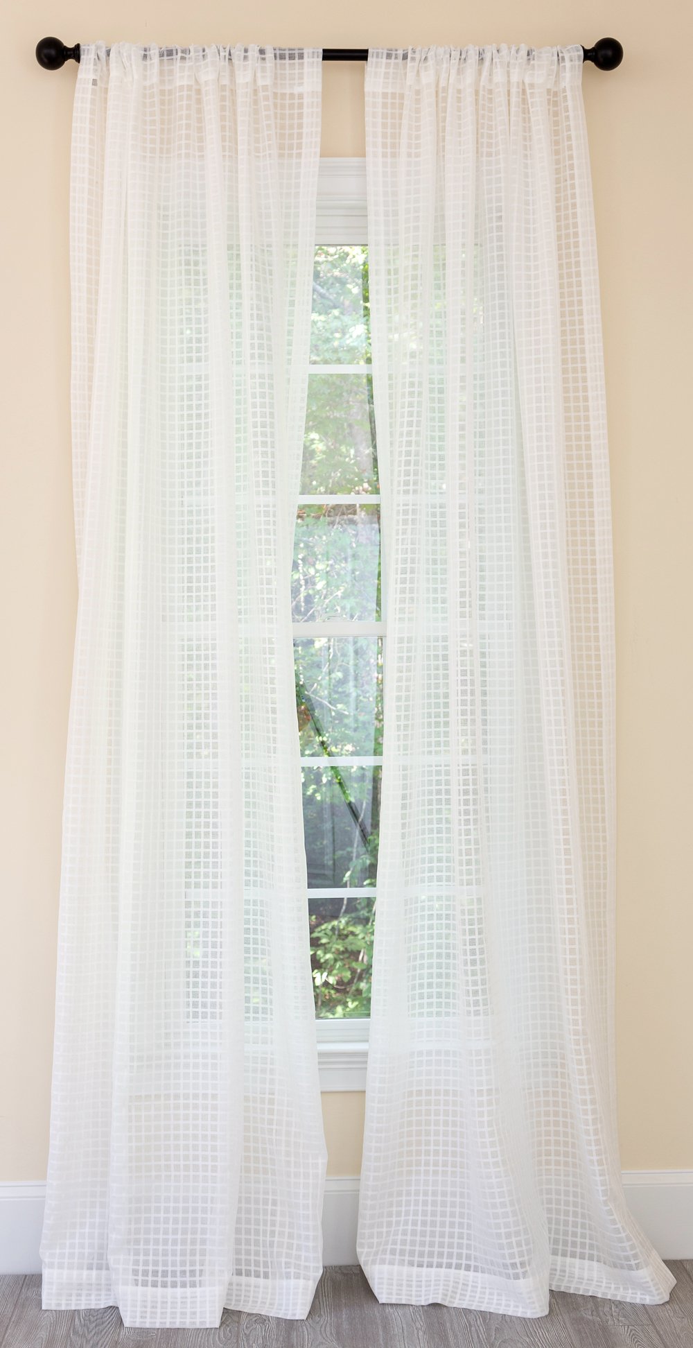 ML16246 Bonita Plaid Sheer Curtain featuring a checkered design, soft fabric, and diffused light filtering through.