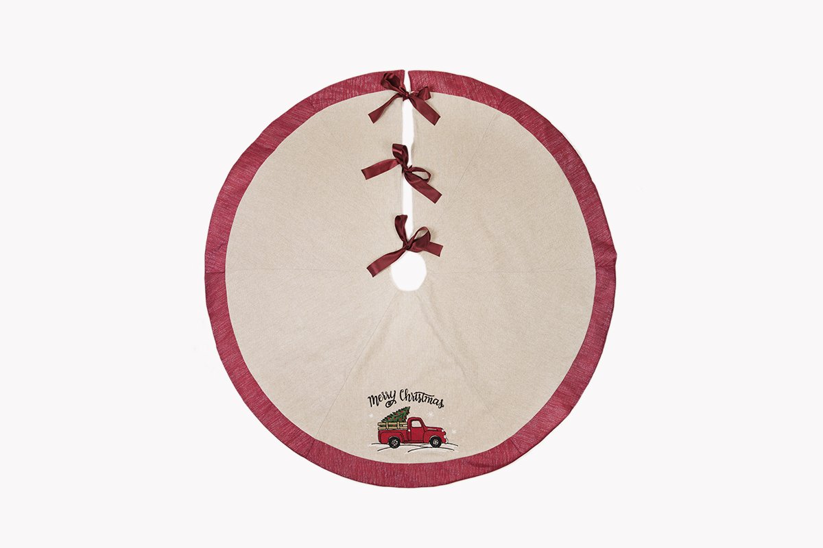 A festive 56-inch Christmas tree skirt featuring a whimsical red pick-up truck design, perfect for holiday decorations.