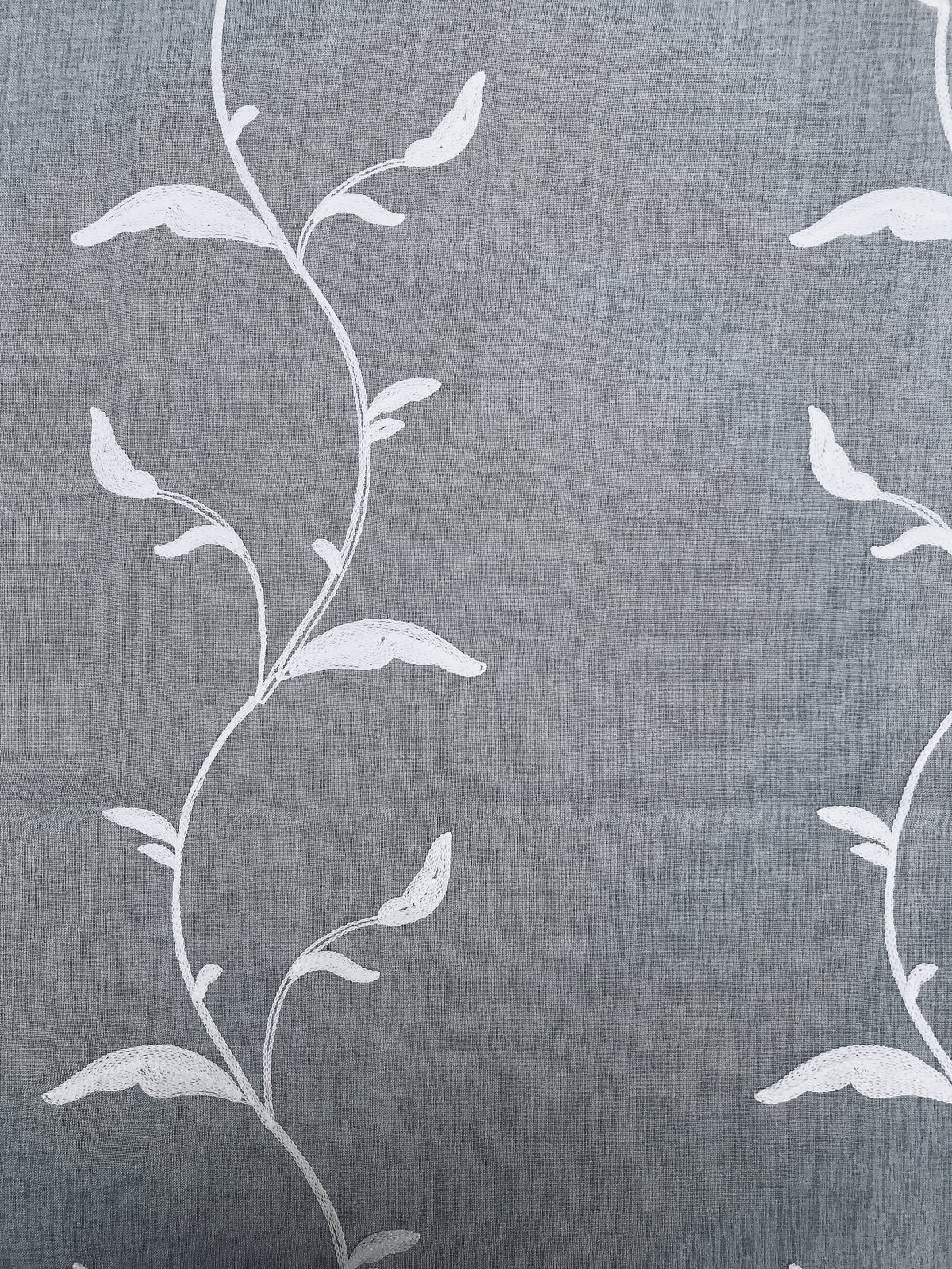 ML19011 Breeze Wavy Sheer Curtain featuring embroidered leaves on white sheer fabric, elegantly diffusing light.