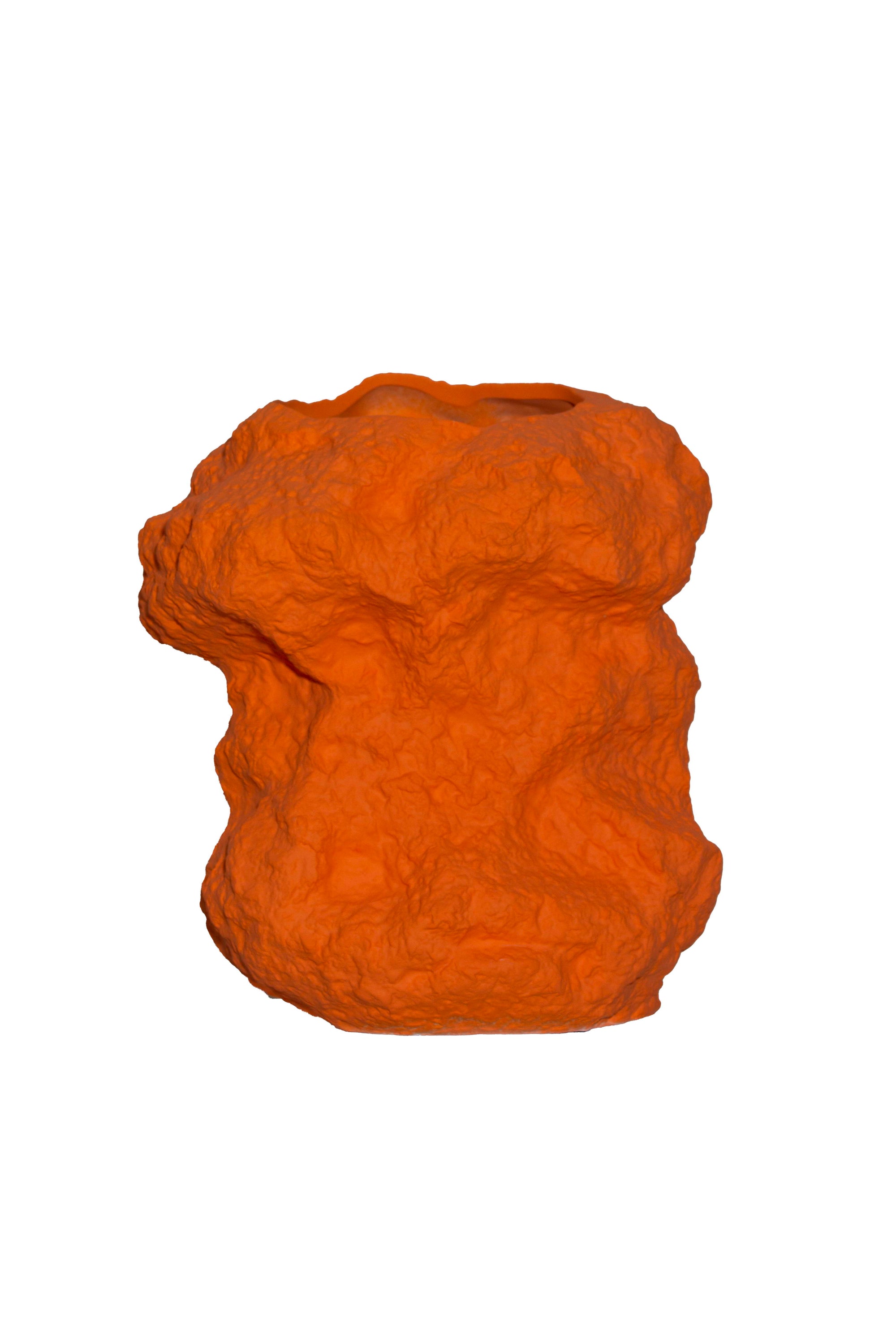 Modern design rock-like vase in bright orange ceramic, showcasing a unique shape and texture, perfect for floral arrangements.