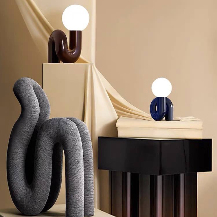 Modern Spiral Bedside Table Lamp showcasing a quirky design with a rounded form, perfect for adding charm to any room.