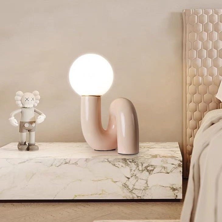 Modern Spiral Bedside Table Lamp showcasing a quirky design with a rounded form, perfect for adding charm to any room.