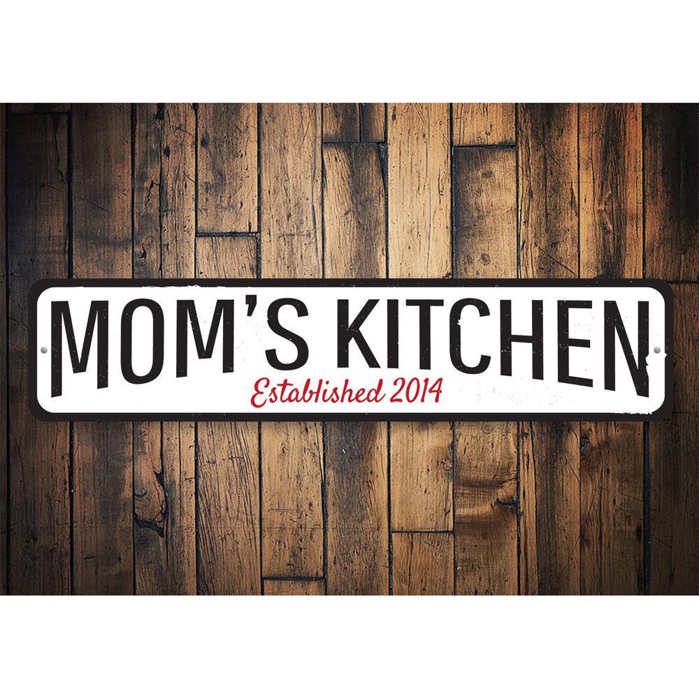 A personalized Mom's Kitchen Established Sign made of high-quality aluminum, featuring custom text and a decorative design, perfect for kitchen decor.