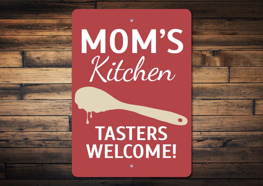 A beautifully crafted Mom's Kitchen Sign made from high-quality aluminum, featuring customizable text and pre-drilled holes for easy mounting.