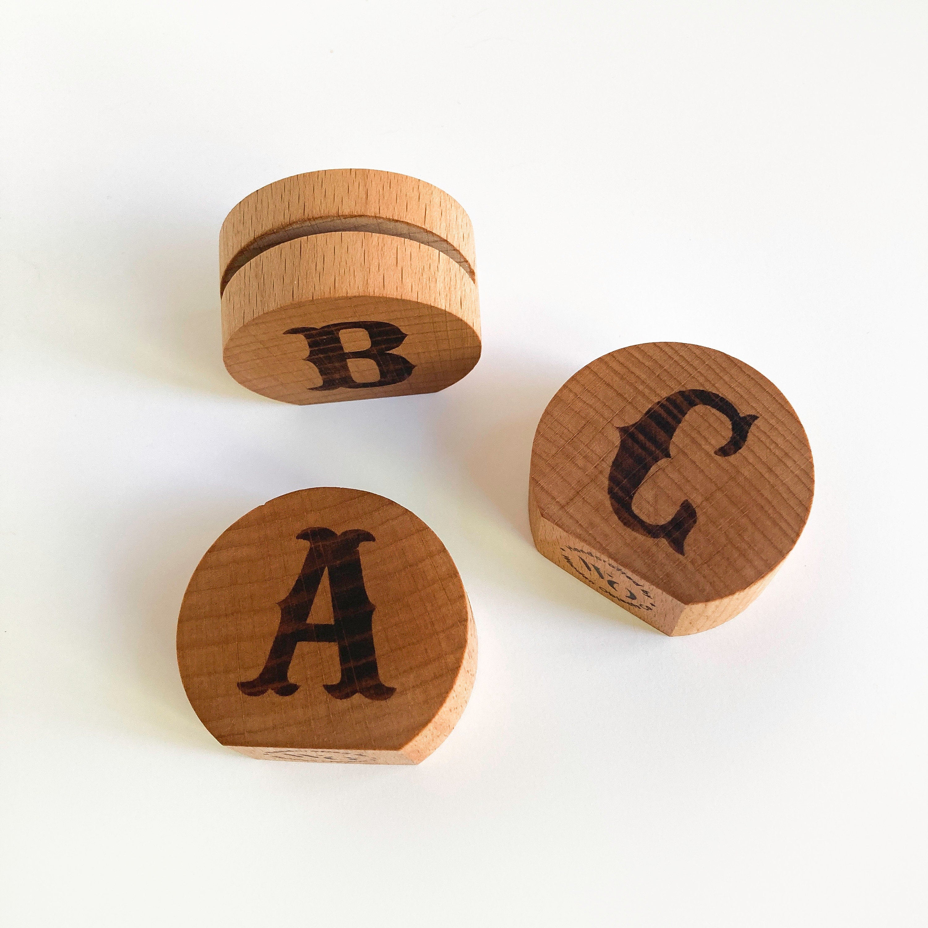 Handcrafted Monogram Moon Photo Holder made from eco-friendly wood, showcasing a small photo in a stylish moon shape.