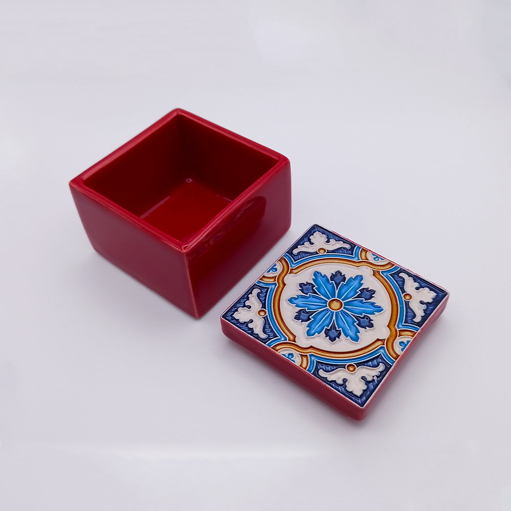 A beautifully handcrafted Monsaraz Ceramic Box featuring intricate designs and vibrant colors, perfect for storage or decoration.