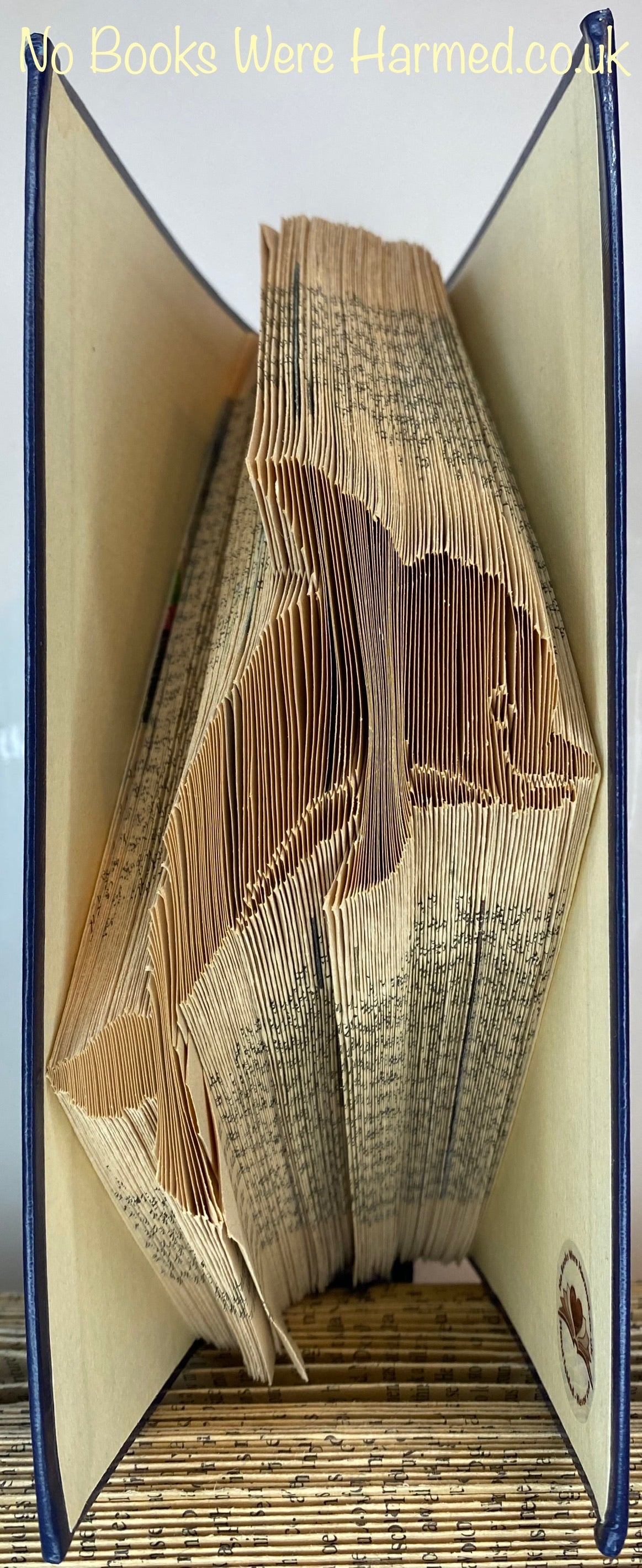 Handcrafted Moray Firth Bottlenose Dolphin art made from vintage book pages, showcasing intricate folds and unique design.