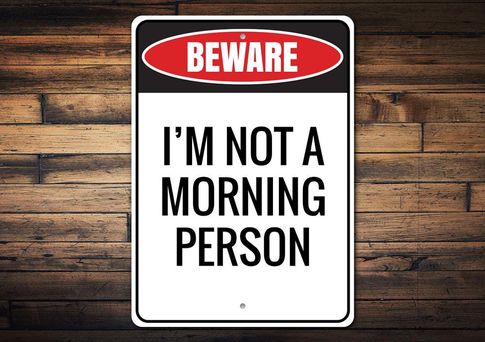 A decorative Morning Person Sign made of high-quality aluminum, featuring a cheerful design suitable for home decor.