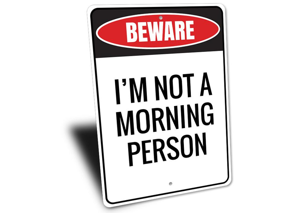 A decorative Morning Person Sign made of high-quality aluminum, featuring a cheerful design suitable for home decor.