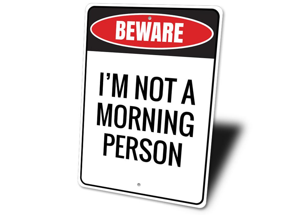 A decorative Morning Person Sign made of high-quality aluminum, featuring a cheerful design suitable for home decor.