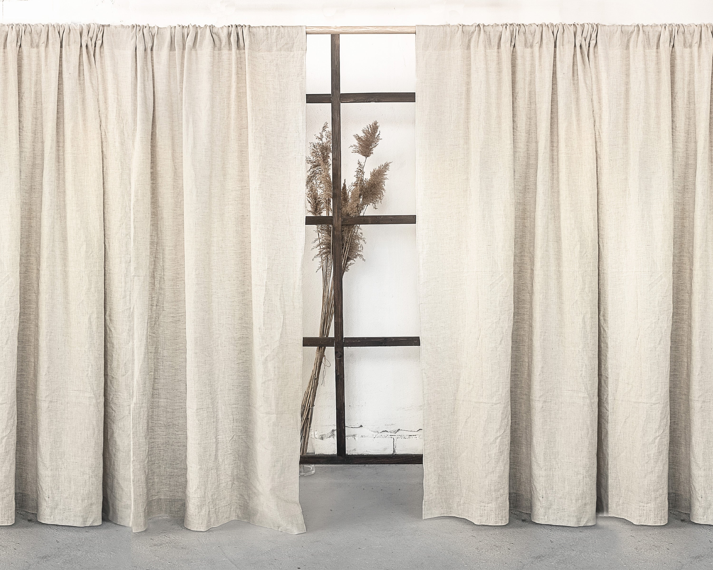 Moss green linen curtain with rod pocket, showcasing its semi-sheer texture and elegant color.