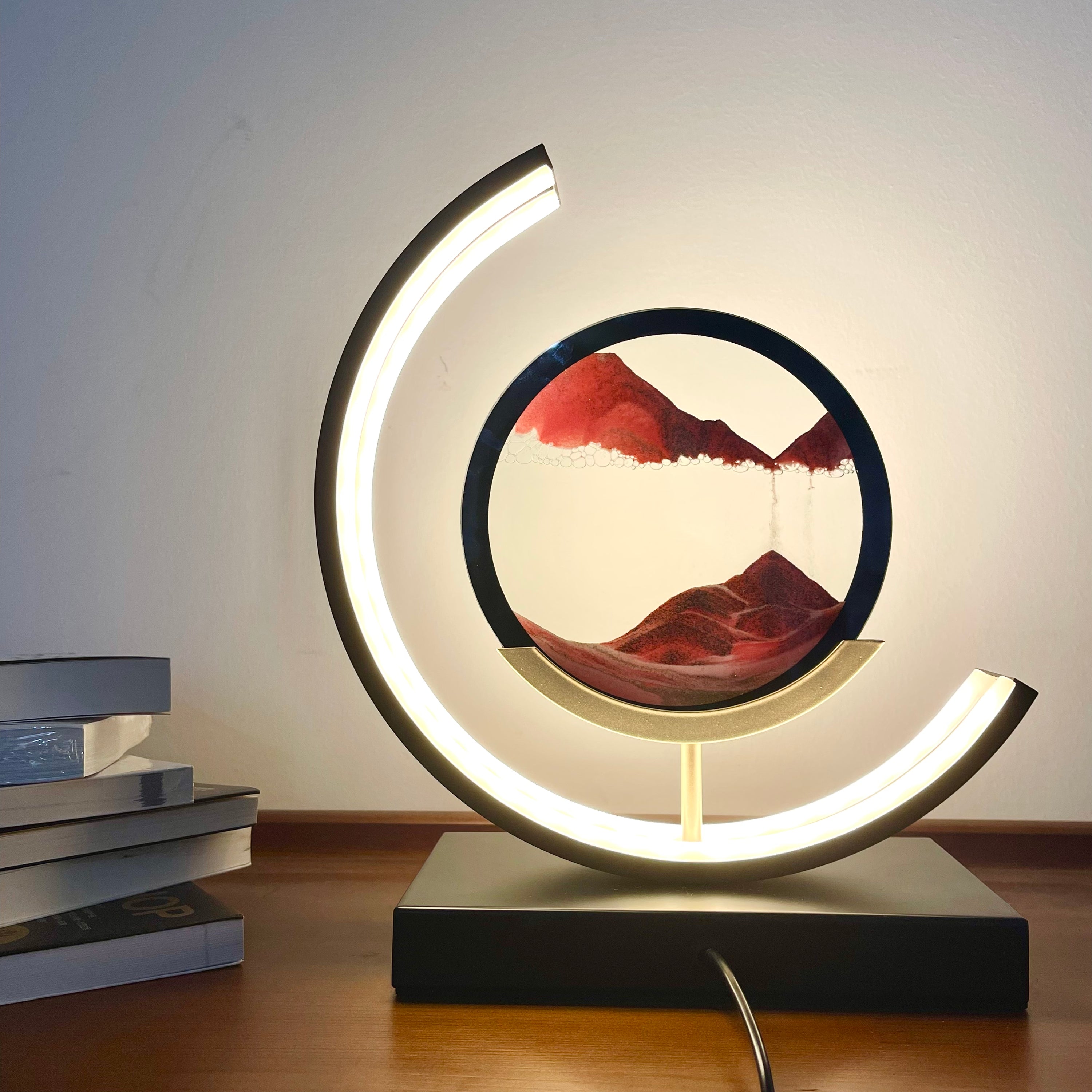 Moving Sand Sandscapes LED Table Lamp showcasing dynamic sand art and adjustable brightness features in a sleek aluminum and glass design.