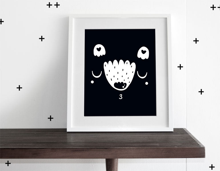 Mr. Happy Bear Wall Art featuring a cheerful bear design, perfect for nursery decor, framed with a white matte.