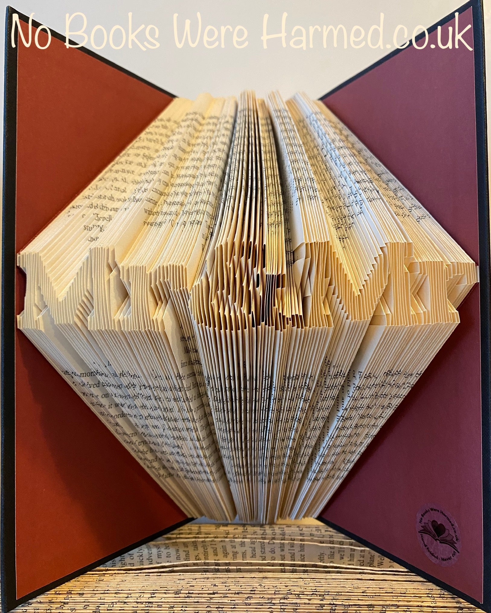 Handcrafted Mr&Mr book art made from vintage books, showcasing intricate folded pages in unique designs.