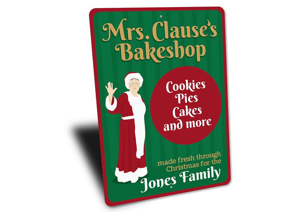 Mrs. Clause's Bakeshop Sign featuring festive holiday design, made from high-quality aluminum with pre-drilled holes for easy mounting.