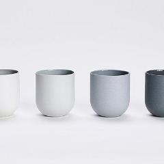 Set of 4 SUM GRADIENT mugs in blue and grey, showcasing smooth glazed interiors and raw matte exteriors, perfect for stylish coffee enjoyment.