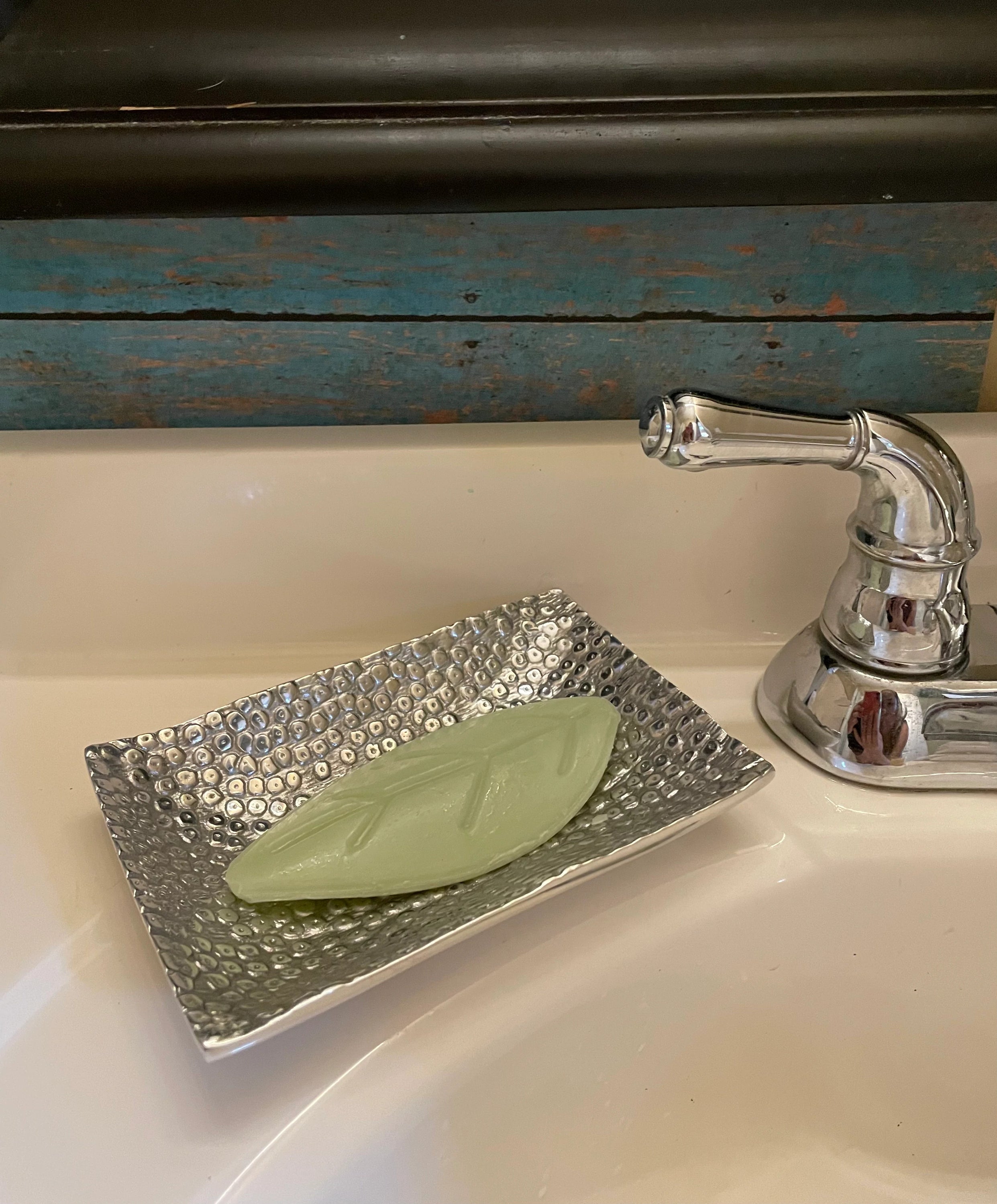 Multi-Purpose Soap Dish and Jewelry Bowl made of recycled aluminum with a chic hand-cast finish, showcasing its artistic design and minimalist style.