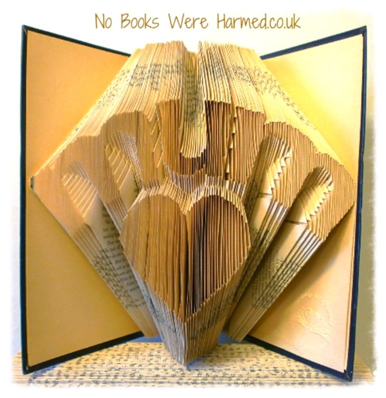 Handcrafted 'Mum' over love heart art made from vintage book pages, showcasing intricate folds and unique design.