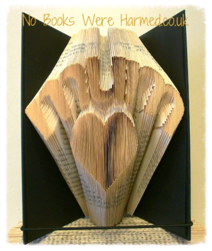 Handcrafted 'Mum' over love heart art made from vintage book pages, showcasing intricate folds and unique design.