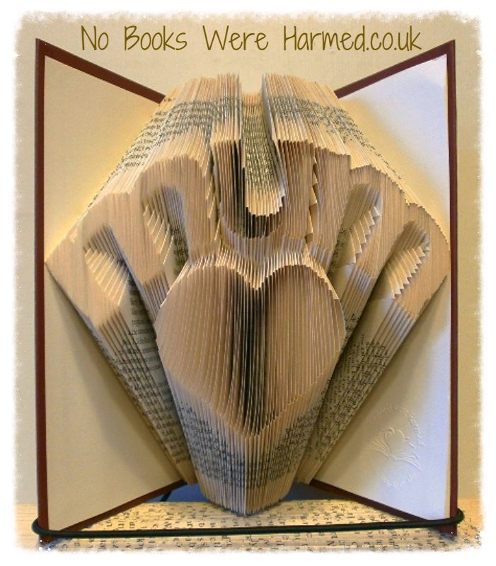 Handcrafted 'Mum' over love heart art made from vintage book pages, showcasing intricate folds and unique design.