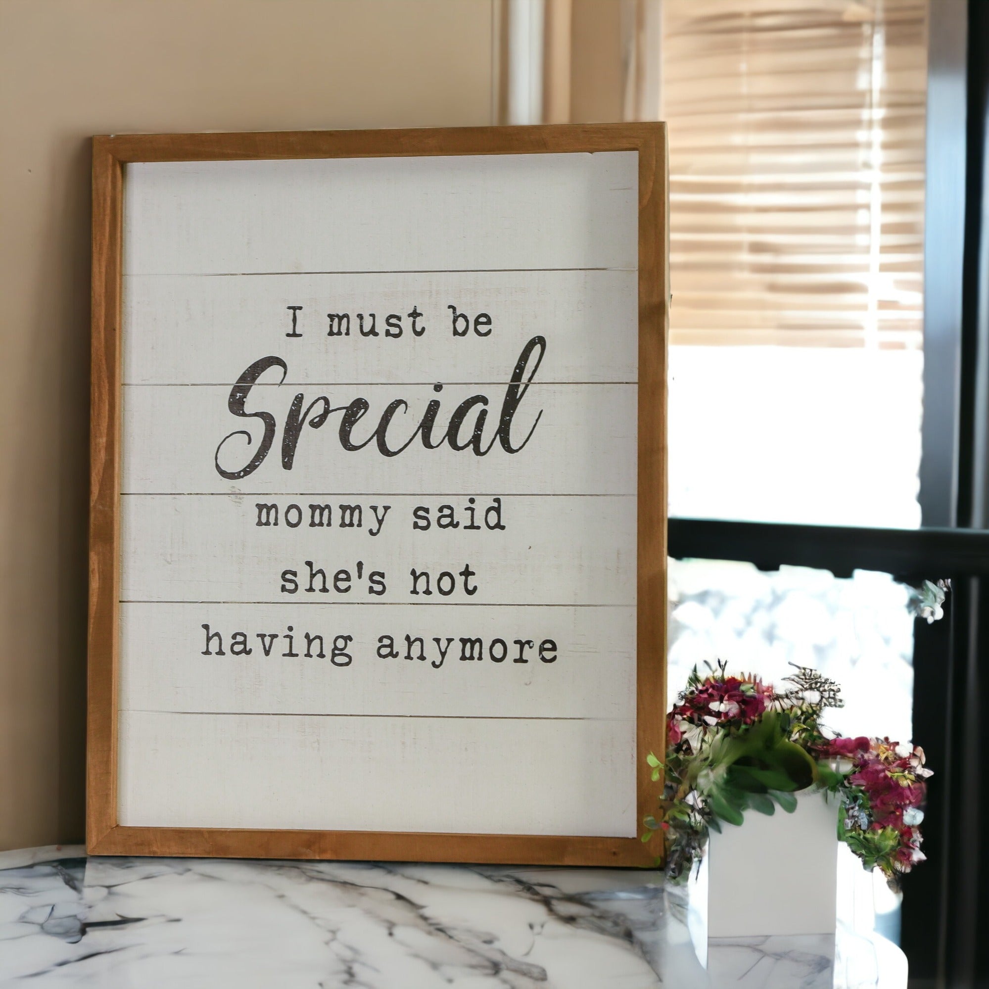 A rustic wooden sign reading 'Must Be Special', handmade with natural knots, perfect for nurseries and playrooms.