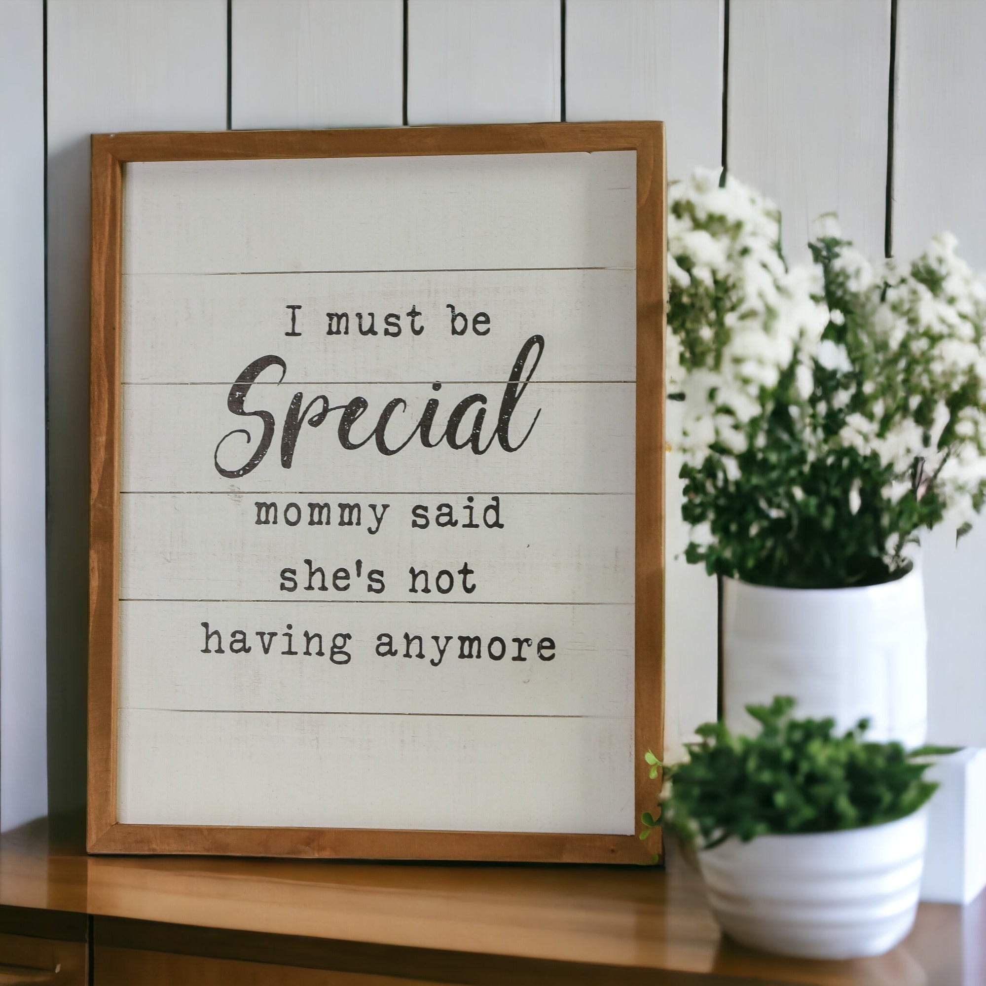 A rustic wooden sign reading 'Must Be Special', handmade with natural knots, perfect for nurseries and playrooms.