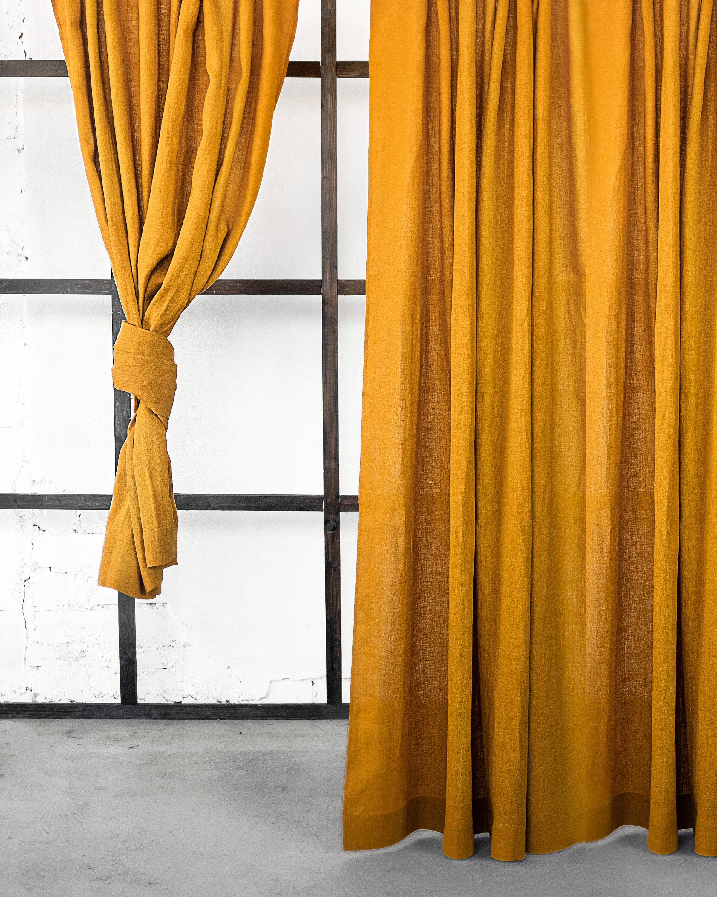 Mustard linen curtain with multifunctional heading tape, showcasing its semi-sheer fabric and elegant design.