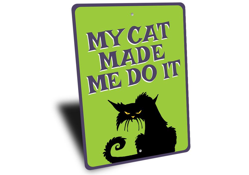 A humorous metal sign reading 'My Cat Made Me Do It', showcasing a playful design suitable for cat lovers.