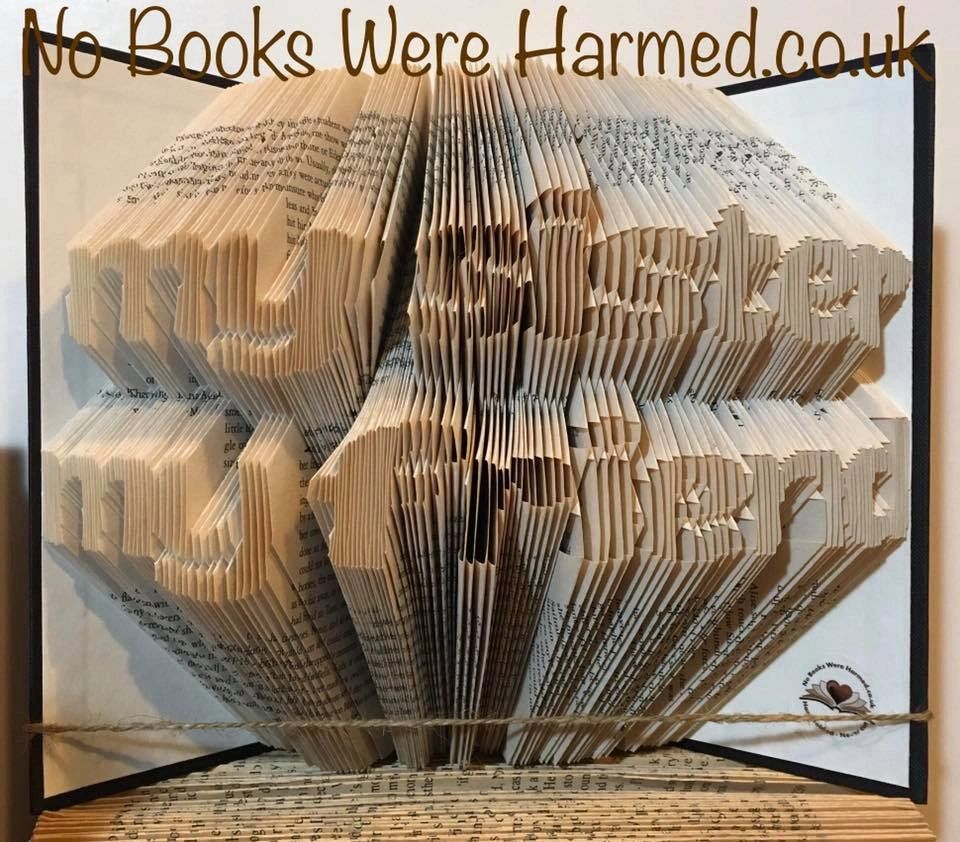 Handcrafted book art titled 'My Sister My Friend', showcasing intricate hand-folded pages from vintage books, each piece unique in color and design.