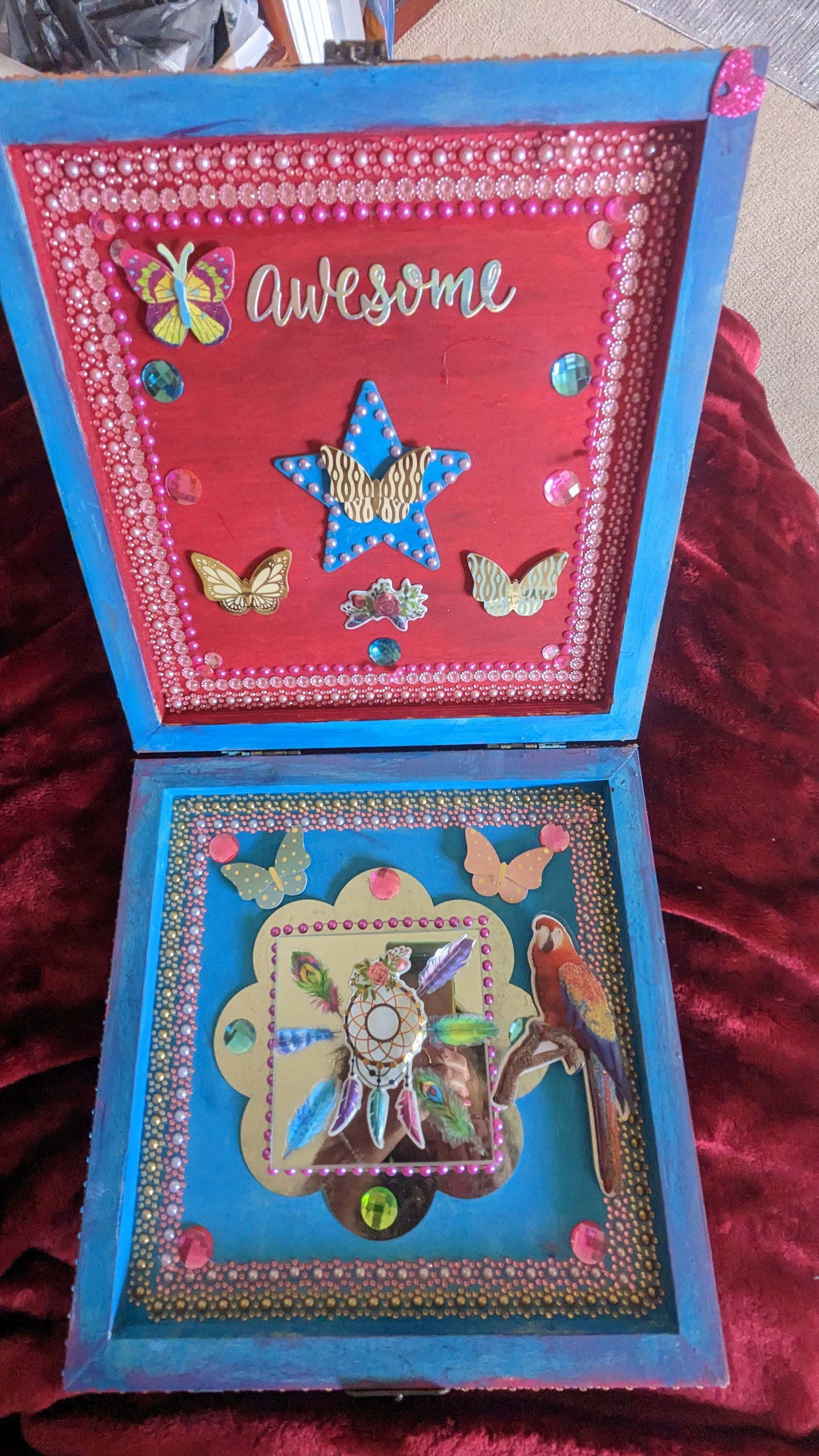 A beautifully hand-decorated Wish Box by Sharon Tatem featuring intricate designs and a powerful maiden, symbolizing dreams and magic.