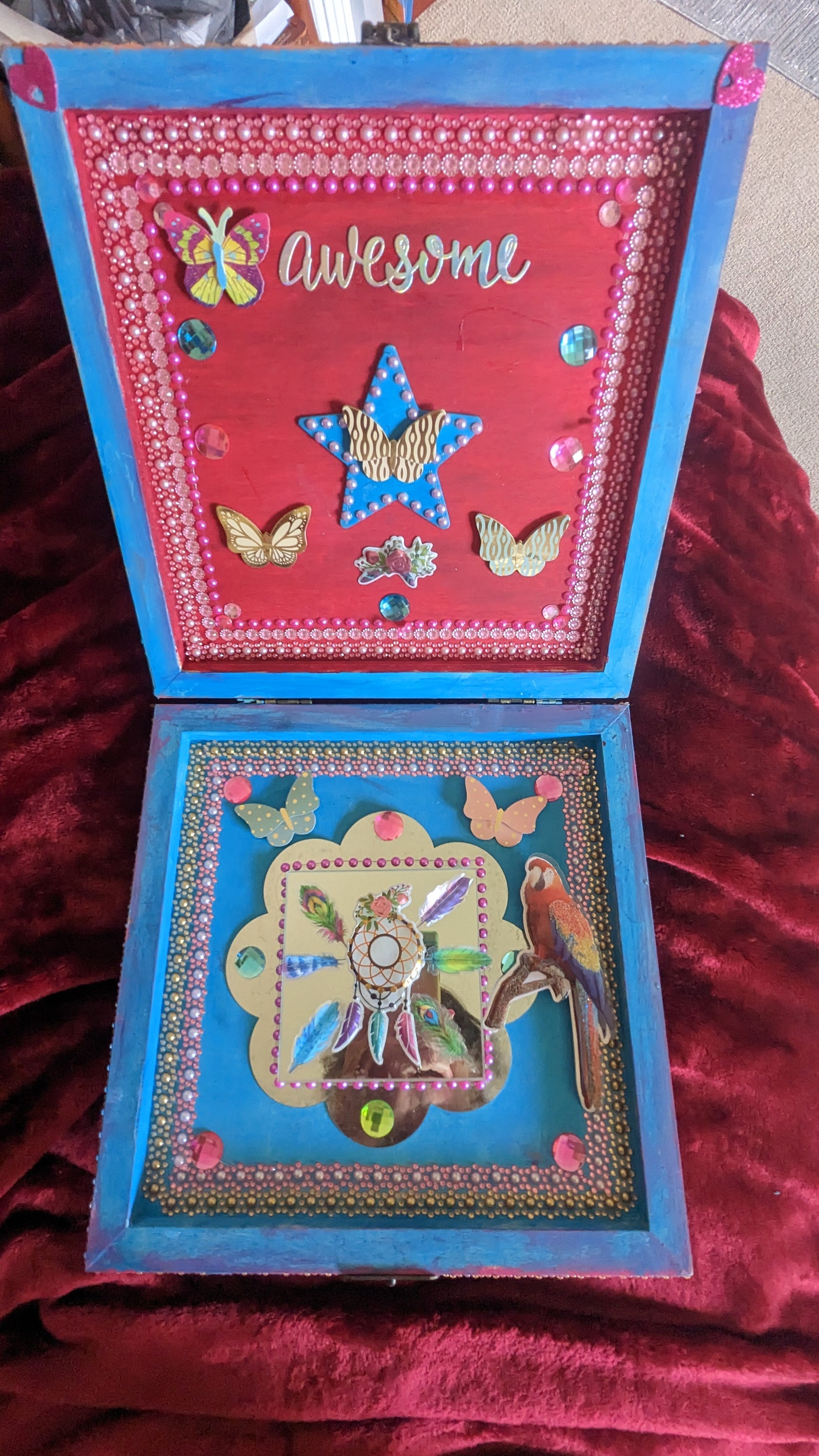 A beautifully hand-decorated Wish Box by Sharon Tatem featuring intricate designs and a powerful maiden, symbolizing dreams and magic.