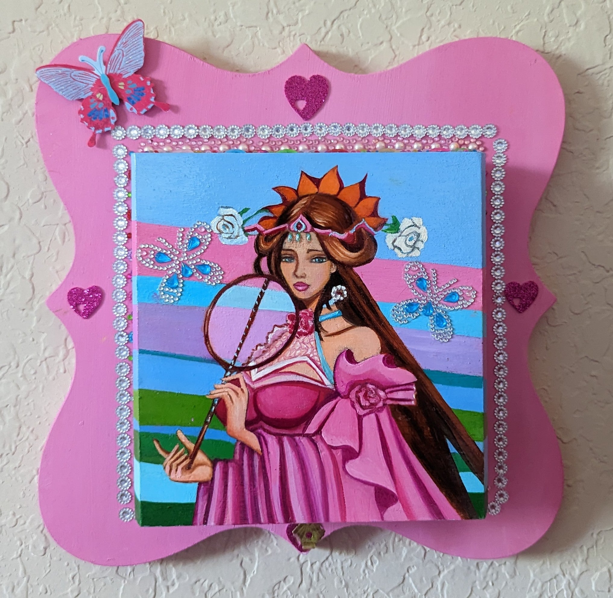 A beautifully hand-decorated Wish Box by Sharon Tatem featuring a powerful maiden in vibrant colors, symbolizing dreams and magic.